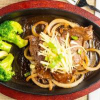 Sizzling Siam Beef · Marinated in sesame oil, white pepper, fresh garlic, onions, stir-fried in our Chef’s sauce ...