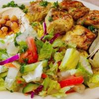 Chicken Shish Kabob · Tikka. 2 skewers, served with rice, hummus, salad or soup and pita bread.