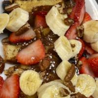 Stuffed French Toast · Stuffed French toast with mixed fruits, custard or nuttela filling topped with pecans.