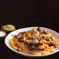 Carne Asada Fries ~ · A plate of freshly fried French Fries, topped with carne asada & melted cheese.
Served with ...