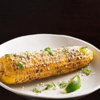 Elote - Mexican Corn · Mayonnaise, fresco cheese, chopped cilantro, classic seasoning, lime wedge.