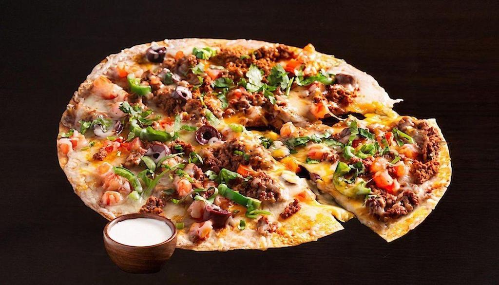 Meat Mexican Pizza ~ · It's Pizza, El Fresco Style!
We take a large ﬂour tortilla crust and top it with your choice of meat, and sprinkle it with two different cheeses, cilantro, black olives, tomatoes, jalapeños and sour cream.
