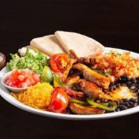 Chicken Fajitas · Marinated strips of chicken sautéed with onions, green pepper & tomatoes. Served with Spanis...