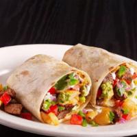 California ~ · (Served Handheld)
Carne asada, potatoes, pico, sour cream, and guacamole.
All wrapped in a l...