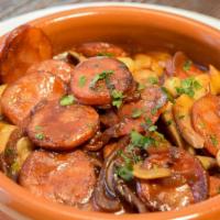 Chorizo Espanol · Sautéed with white beans, fig demi-glace and shiitake mushroom. Gluten-free.