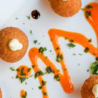 Cheese Croquettes · Goat, Parmesan cheese, blue cheese, green and red peppers.