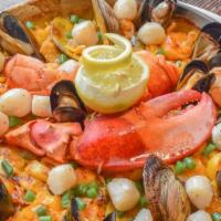 Seafood Paella For 2 · Fish of the day, lobster, clams, mussels, scallops, shrimp.