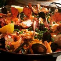 Seafood Paella For 3 · Fish of the day, lobster, clams, mussels, scallops, shrimp.