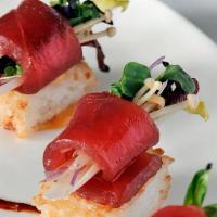 Crispy Sushi* · Yellowfin tuna crudo, Korean chile, enoki honeycrisp apple, crispy rice. 

Food items raw or...