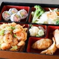 Shrimp Bento · Served with mixed vegetable. Four pieces California roll, two pieces chicken dumpling, and t...