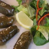 Stuffed Grape Leaves (Dolmeh) · Cooked tender grape leaves stuffed with whole grain, rice, and herbs.