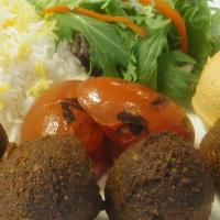 Falafel Platter · Falafel patties with rice, hummus, green salad, and grilled tomatoes.