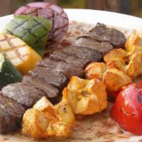 Chicken And Beef Kabob · One skewer of chicken breast and a skewer of chunks of beef sirloin. Served with grilled veg...