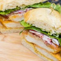 Lumber Jack · Crispy chicken filets topped with melted jack cheese, crispy bacon, lettuce, tomatoes, onion...