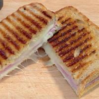 Ham & Swiss Panini · Thin slices of premium ham with melted Swiss cheese, sweet & spicy honey mustard then butter...