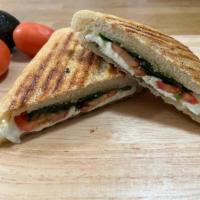 Caprese Panini · Fresh sliced mozzarella with tomatoes in a French roll with pesto spread, sprinkled basil an...