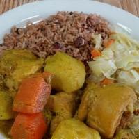 Brown Stew And Curried Chicken · Served with rice & peas and veggies.
