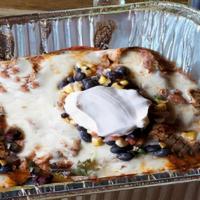 Tijuana Trainwreck Meal Deal (Serves 4) · Machaca chicken, Chile verde, Chile con carne, bolo beans, jack cheese, and topped with sour...