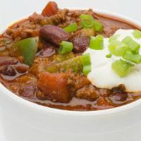 Chile Con Carne (Cup) · Diced lean pork shoulder, braised with new Mexican red chiles in a rich pork stock. Topped w...