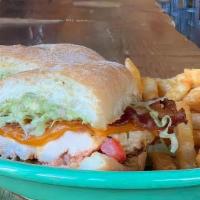 California Club Sandwich · Grilled chicken, bacon, guac, tomatoes, cheese, and ancho aioli on ciabatta bun