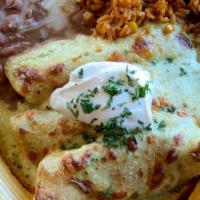 Chicken Enchiladas Suizas · Three corn tortillas filled with seasoned chicken and red chile sauce topped with creamy tom...
