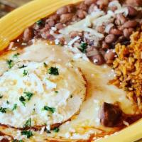Stacked Enchiladas · Three corn tortillas, layered with chile con carne and Monterey jack cheese, baked and toppe...