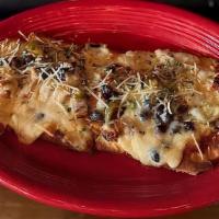 Black & White Pizza · Grilled chicken, black beans and alfredo sauce topped with Monterey jack cheese and jalapeño...