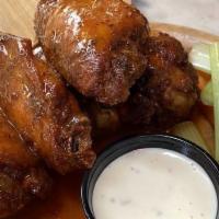 Chicken Wings · Jumbo wings served with carrot and celery (choice buffalo or bourbon BBQ).