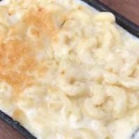 4-Cheese Mac & Cheese · Elbow macaroni baked in a cheddar, mozzarella and Fontina cheese sauce, topped with Parmesan.