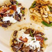 Alambre · Corn/flour tortilla, filled with steak and bacon, bell peppers, onion and melted Oaxacan che...
