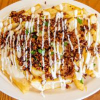 Chorizo Fries · Steak cut fries topped with cheese dip and chorizo, drizzled with sour cream and cilantro.