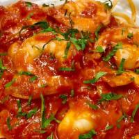 Shrimp Marinara · Jumbo shrimp sauteed in a garlic, marinara wine sauce over linguini.