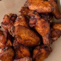 Smoked Chicken Wings - Double · 16 Wings - Smoked, then flash fried. Dry-rubbed or tossed in your choice of sauce. Served wi...