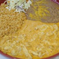 Pollo A La Crema · Strips of chicken breast Sautéed with onions in a crema sauce. Garnished with cotija Mexican...