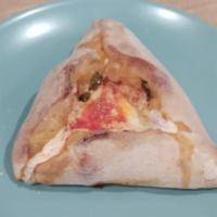 Pizza Focaccia · Our focaccia topped with our shakshuka tomato sauce, mozzarella cheese, ricotta cheese and o...