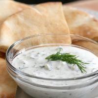 Tzatziki With Pita Bread · Tzatziki is Greek yoghurt with cucumber, garlic, and herbs.