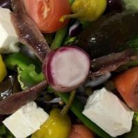 Greek Salad · Romaine lettuce, tomato, cucumber, feta cheese, black olives, pepperoncini peppers, capers, ...