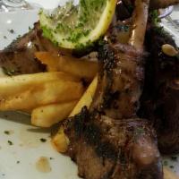 Lamb Chops · Marinated in red wine, herbs, and spices, then grilled over a charcoal flame to order.