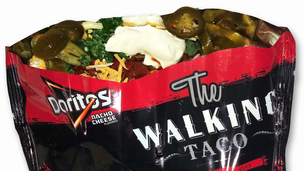 Walking Taco · Our classic with taco meat & crushed cheddar nachos covered in shredded cheese, lettuce, salsa, & sour cream.