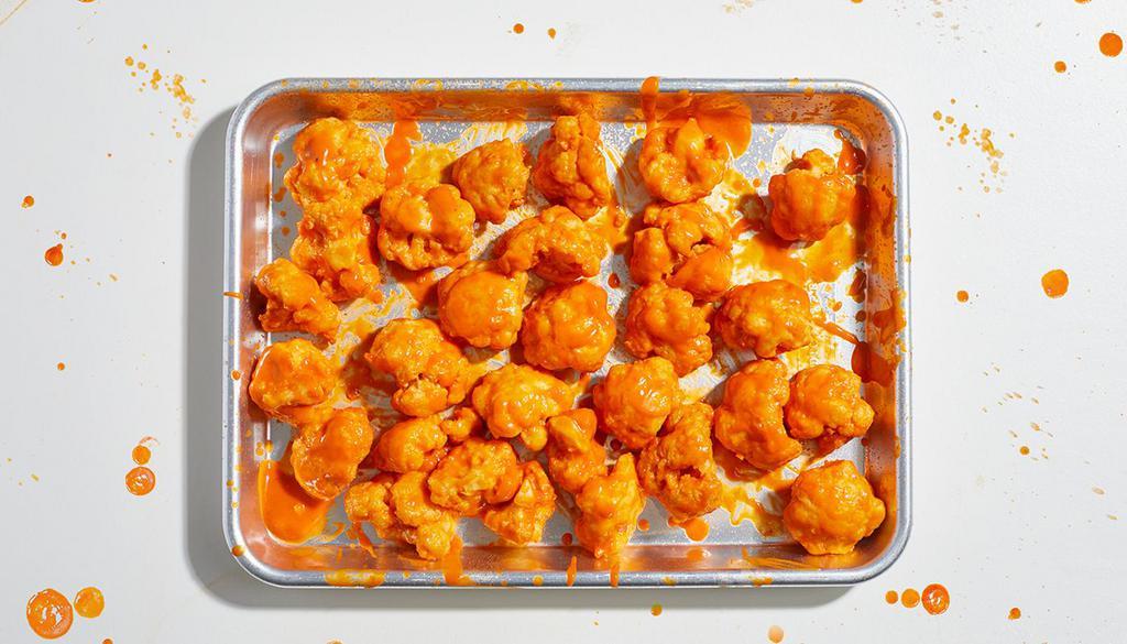 10 Piece Cauliflower Bites · 10 crispy bites of cauliflower fried to perfection and tossed in your choice of sauce. Served with celery and ranch or blue cheese.