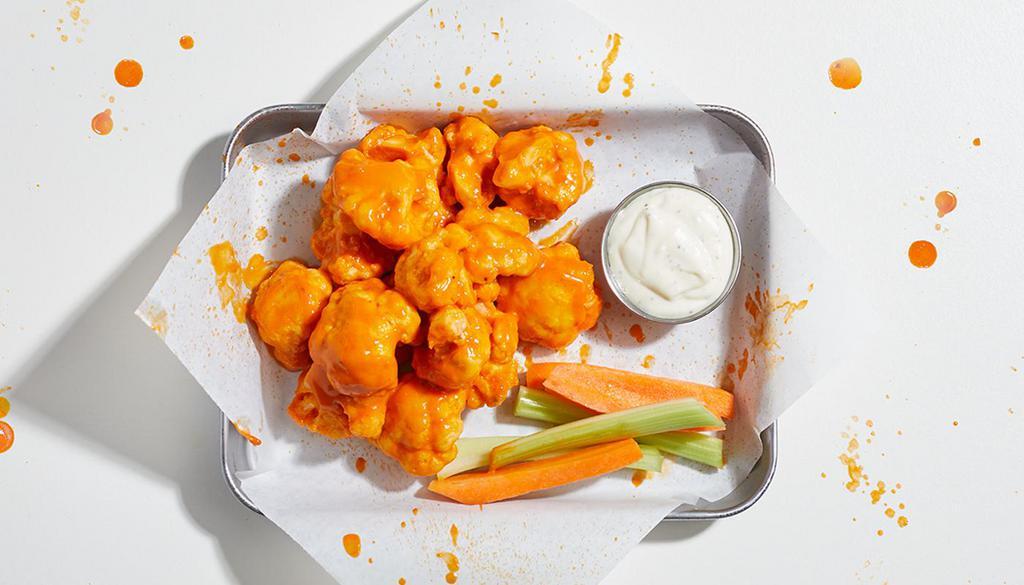5 Piece Cauliflower Bites · 5 crispy bites of cauliflower fried to perfection and tossed in your choice of sauce. Served with celery and ranch or blue cheese.