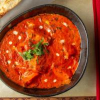 Butter Chicken · Charbroiled chicken simmered in a creamy tomato based gravy.