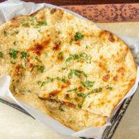 Garlic Naan · Tandoori white flower bread plain with garlic.