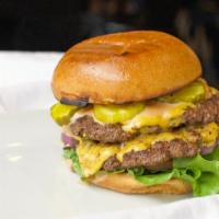 Big Double Basic Cheeseburger · Two 1/4lb certified Angus beef patties served with two slices American cheese, crisp lettuce...