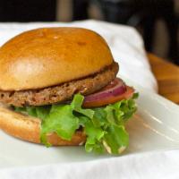 Basic Veggie Burger · House Veggie patty served with crisp lettuce, fresh tomato, sliced red onion, and our signat...