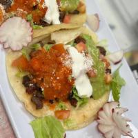 American Taco · Served with your choice of meat. Tacos Americanos servidos con cebolla, cilantro, tomate, le...