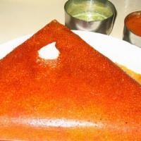 Mysore Masala Dosa · Thin Rice crepes with layer of hot chutney filled with Potato masala and Onions.