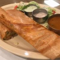 Woodlands Spring Dosa · Thin Rice crepes filled with vegetables and hot chutney.