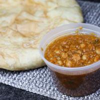 Chole Batura · Large puffy bread served with Chickpeas.