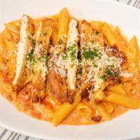 Penne A La Vodka · Penne pasta sautéed with vodka cream tomato sauce.
Add shrimp and chicken for an additional ...